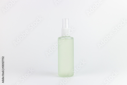 cosmetic bottle isolated on white background  green liquid soap or shampoo