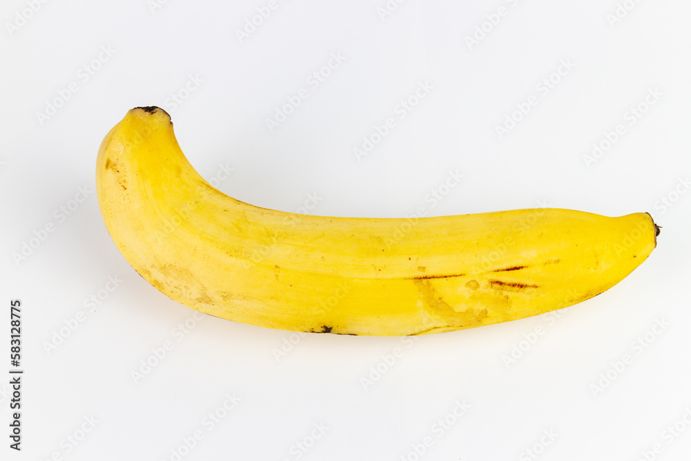 Ripe banana on a white background, isolate, close-up