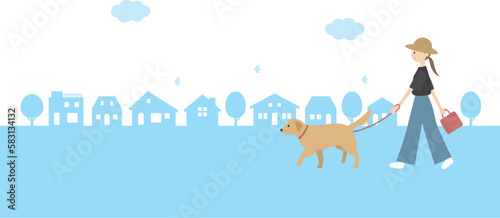 ゴールデンレトリバーの散歩をする女性とシンプルな街並み