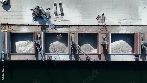 Work at a huge limestone quarry, production of aggregates., heavy machines in action, transferring the material, crusher complex, travel with ships