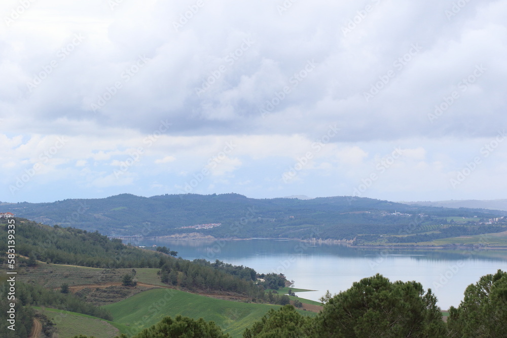landscape view with lake and forest on the background of mountains. landscape view with lake and forest on the background of mountains.