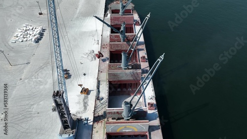 Work at a huge limestone quarry, production of aggregates., heavy machines in action, transferring the material, crusher complex, travel with ships