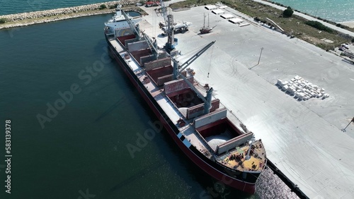 Work at a huge limestone quarry, production of aggregates., heavy machines in action, transferring the material, crusher complex, travel with ships