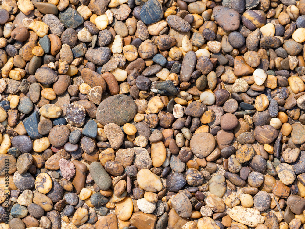 Background of pebbles. Wet stones. Multicolored pebbles. River shore. Background of pebbles. Wet stones. Multicolored pebbles. River shore.