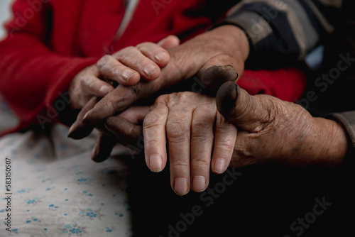 Closeup hand of two senior retired lovers woman and man hold. Concept together grandfather grandmother