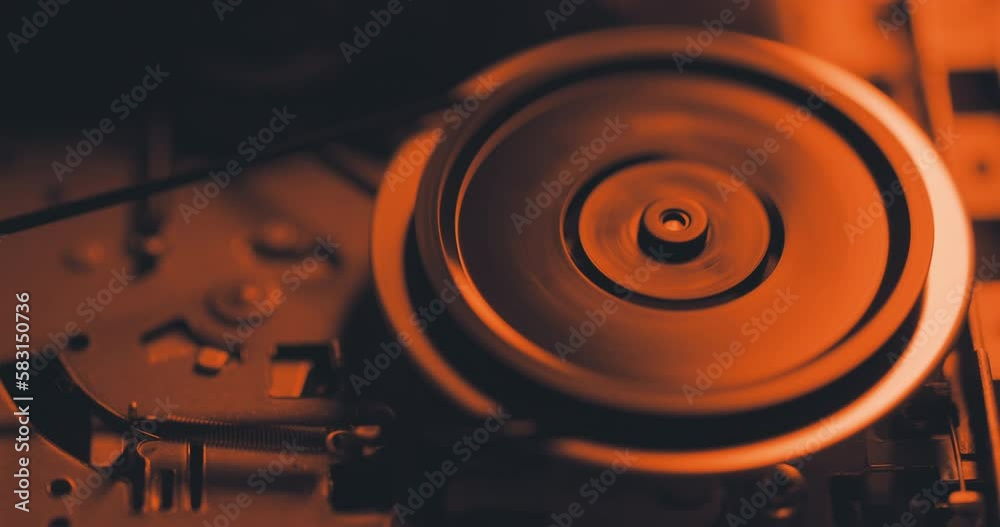 Close up of spinning mechanism inside cassette tape recorder