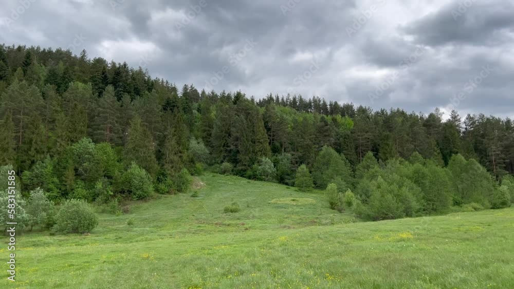 Amazing cloudy sky, mountain valley, green landscape. Green meadow with a mountain in background. Green valley visible beautiful view. Amazing cloudy sky, mountain valley, green landscape. Green meadow with a mountain in background. Green valley visible beautiful view.