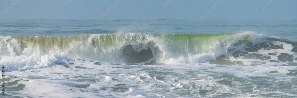 Wave crashing on the shore, California
