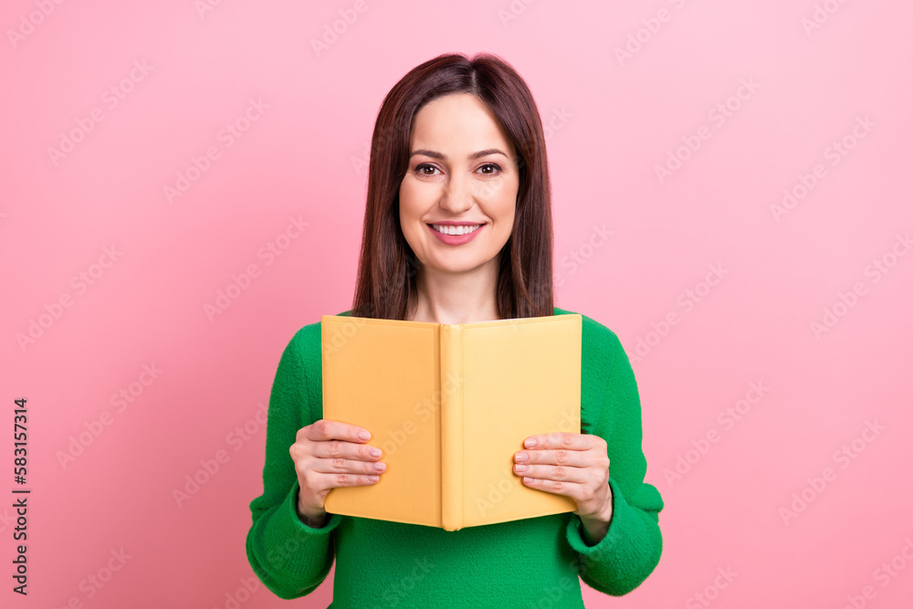 Photo of sweet cheerful lady dressed green pullover enjoying interesting story isolated pink color background Photo of sweet cheerful lady dressed green pullover enjoying interesting story isolated pink color background