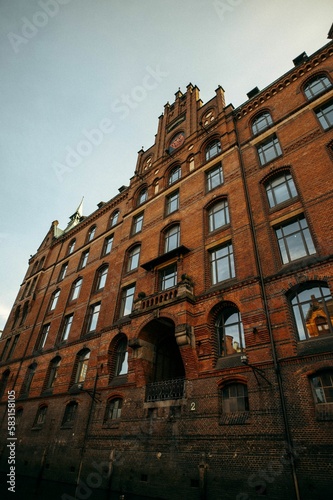 Vertical low angle shot of a historic brick building exterior in Hamburg, Germany