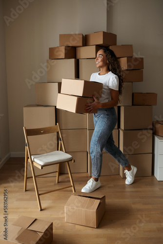 Young Asian female business owner online prepare parcel boxes for customers to call and talk to customers to confirm receipt of goods. Check balance and delivery address and phone number