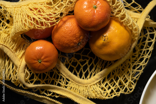 orange, mandarin, fresh fruit on yellow cloth bag
 photo