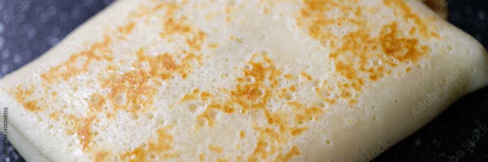 Pancake stuffed with meat cheese and fruit closeup Pancake stuffed with meat cheese and fruit closeup