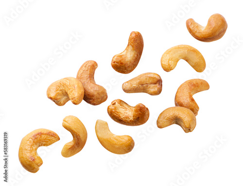 Roasted cashews flying on a white background. Isolated