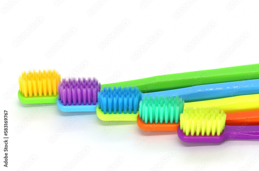 Set of colorful toothbrushes on white background, top view Set of colorful toothbrushes on white background, top view