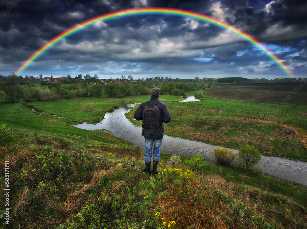 picturesque rainbow over the river. tourist enjoys colorful sunrise. nature of Ukraine picturesque rainbow over the river. tourist enjoys colorful sunrise. nature of Ukraine