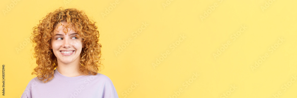 Happy woman with curly hair looking aside Happy woman with curly hair looking aside