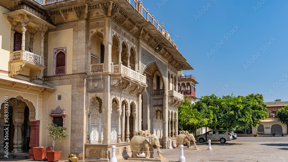 The facade of the ancient City Palace in Jaipur. The building with ...