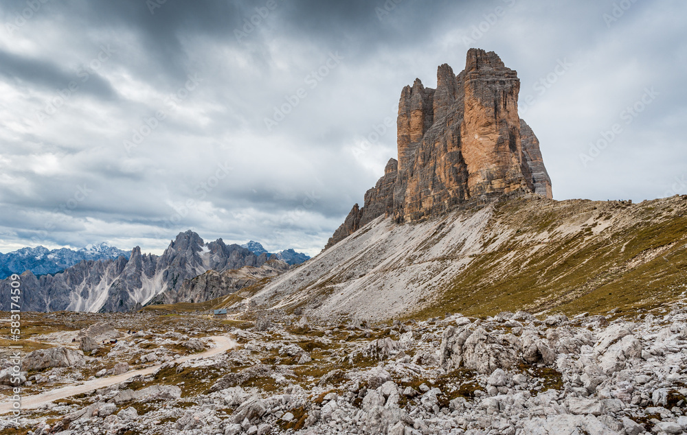 Panorama of Tre Cime mountains in Dolomites with long shadows