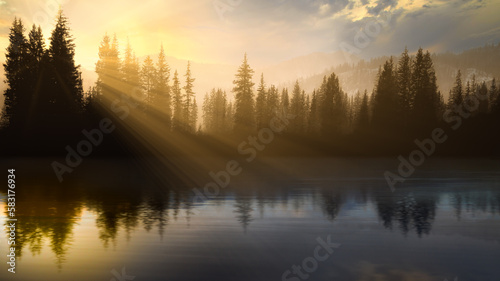 Rays of sunlight and forest reflections in a lake at Sunrise, Utah, USA