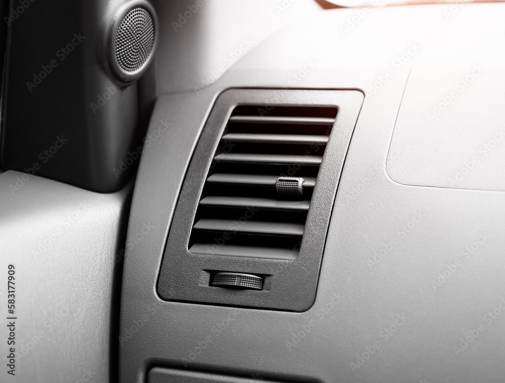 The air vent with a dial to adjust the wind power and direction of the car on the dashboard, Automotive parts concept