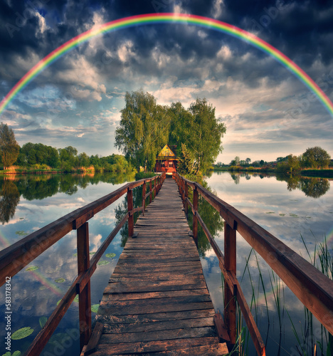 picturesque rainbow over a wooden hut on a small island. fairytale house