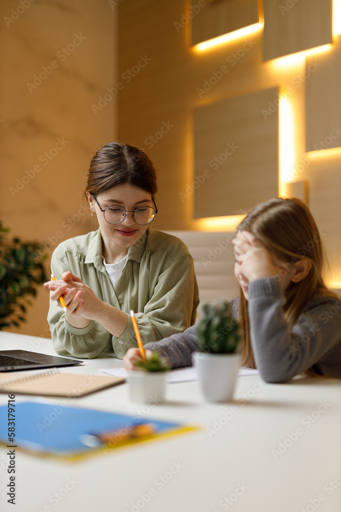 A difficult task at school, the teacher explains in a private lesson. A difficult task at school, the teacher explains in a private lesson.