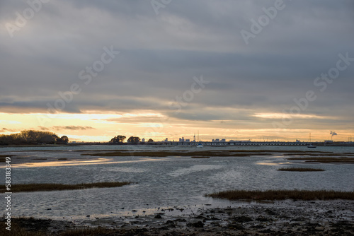 view of Langstone Bridge Hampshire England with the Spinnaker Tower in the background at sunset