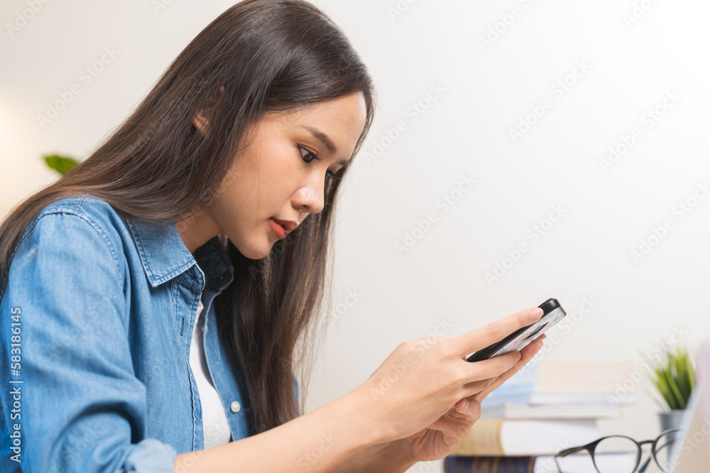 Technology of marketing business, asian young woman using smartphone, mobile phone typing, chatting conversation working office on chat app, hand holding texting. Social media with people contact . Technology of marketing business, asian young woman using smartphone, mobile phone typing, chatting conversation working office on chat app, hand holding texting. Social media with people contact .