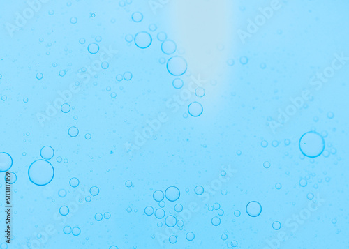 Air bubbles in the water background.Abstract oxygen bubbles in the sea.Water bubbles isolate on blue background.Air bubble floating up to top of water surface which little and big circle shape.
