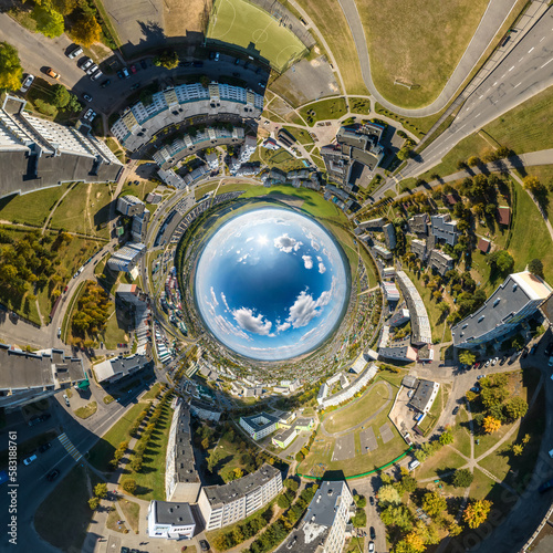 blue sphere inside overlooking old town, urban development, historic buildings and crossroads with cars. Transformation of spherical 360 panorama in abstract aerial view.