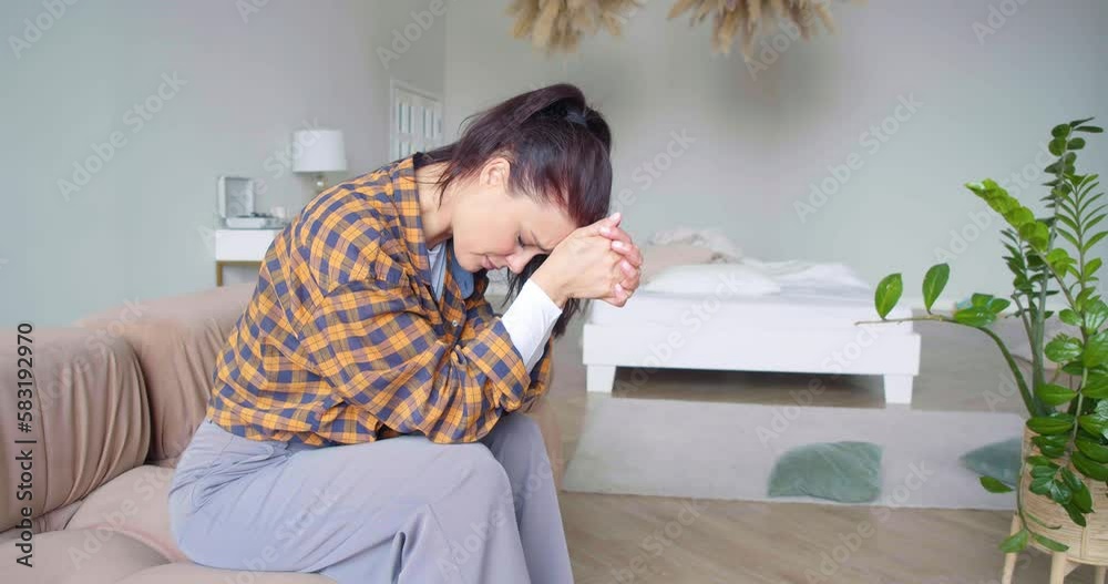 Burnout concept - extremely tired woman comes up and sits on the sofa. Burnout concept - extremely tired woman comes up and sits on the sofa.