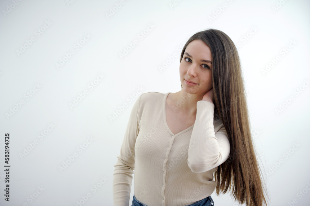 Close-up portrait of yong woman casual portrait in positive view, big smile, beautiful model posing in studio over white background. Caucasian Asian portrait woman. High quality photo
