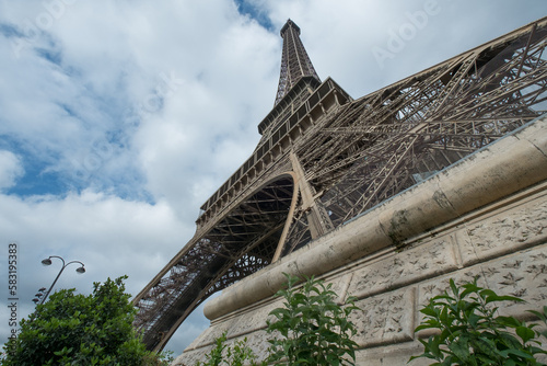 Eiffel Tower in Paris. Dramatic side view with 15mm super wide angle.