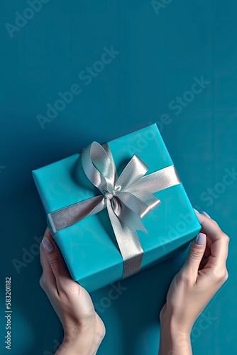 Gift in female hands on a colored background top view. Female hands hold gift box. Copy space for design. Generative AI