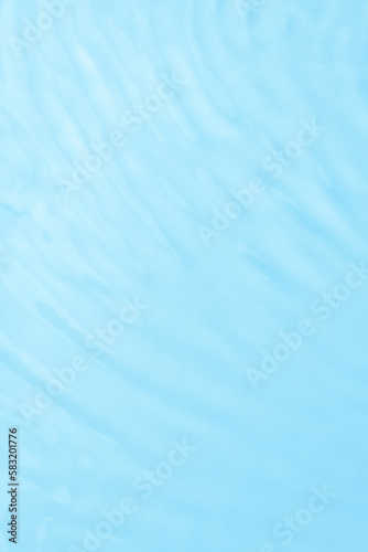 Waves on the surface of the water. gentle light waves, water, top view. Cyan, blue, transparent