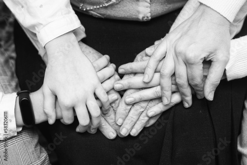 grandmother's hands, daughters and granddaughters, three generations, taking care of old people
