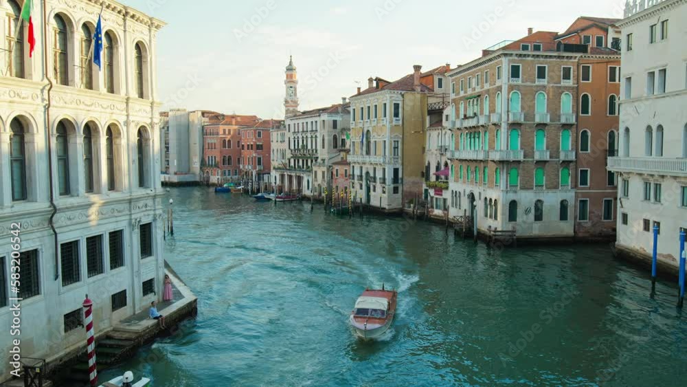 The very scenic and iconic Rialto Bridge in 4K. Grand Canal with boats, ships, and gondolas Venice, Italy. The very scenic and iconic Rialto Bridge in 4K. Grand Canal with boats, ships, and gondolas Venice, Italy.