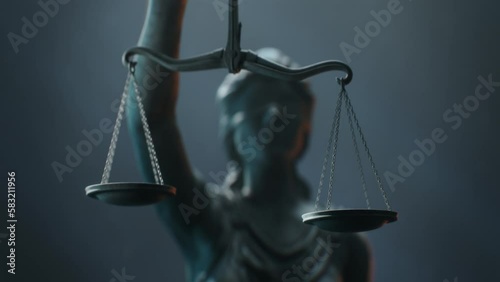 Cinematic and Atmospheric Close-up Shot of Scales that Lady Justice is Holding. The Statue is Blindfolded and Holding Sword.
A Title Sequence for Court Show Mock-up. photo