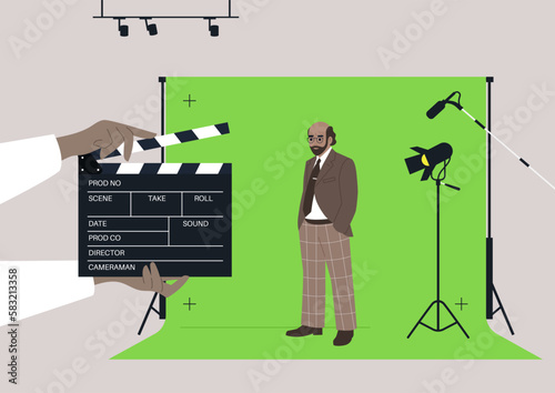 A male Caucasian senior character standing against a chroma key screen in a movie studio, video production