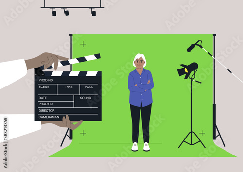 A female senior Caucasian character standing against a chroma key screen in a movie studio, video production