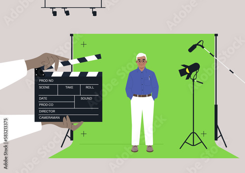 A male senior Caucasian character standing against a chroma key screen in a movie studio, video production