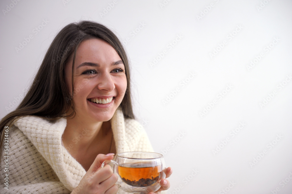 Beautiful young woman drinking tasty tea at home. High quality photo Beautiful young woman drinking tasty tea at home. High quality photo