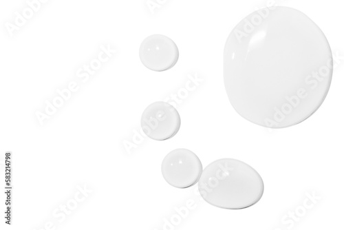 large drops of transparent gel or serum or water  on a white background  top view  isolated