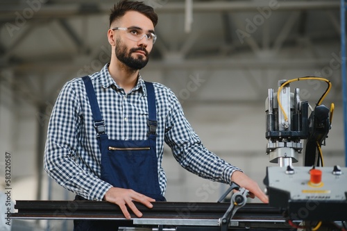 Factory worker. Man working on the production line.