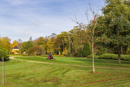 Leek, The Netherlands - October 26, 2022: Lwnn mower at Estate and park Nienoord in Leek municipality Westerkwartier Groningen province in The Netherlands photo