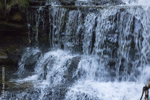 Fototapeta Naklejka Na Ścianę i Meble -  Waterfall outdoors over rocks