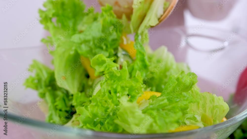 Chef Mixes Vegetable Fresh Salad Food Healthy Meal Mediterranean Kitchen Vegetarian Diet. Slow Motion. Closeup Freshness Salad. Close up Healthy Colorful Food Onion Cucumber Peppers Tomatoes Radishes Chef Mixes Vegetable Fresh Salad Food Healthy Meal Mediterranean Kitchen Vegetarian Diet. Slow Motion. Closeup Freshness Salad. Close up Healthy Colorful Food Onion Cucumber Peppers Tomatoes Radishes