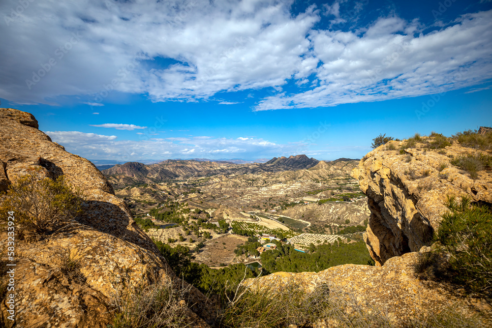 Panoramic view, between rocks, of the arid and semi-wooded area called 