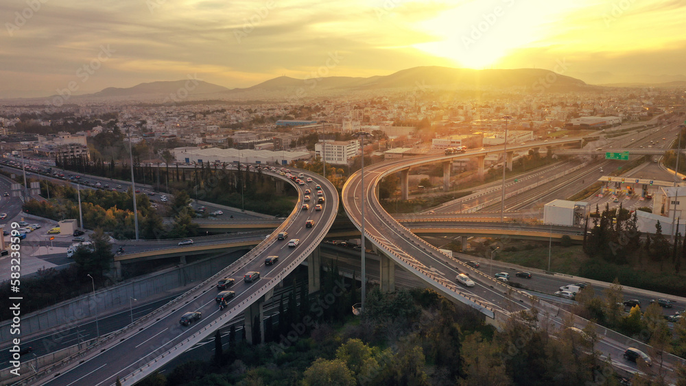 Aerial drone multilevel junction overpass highway with National toll road at rush hour with moderate traffic